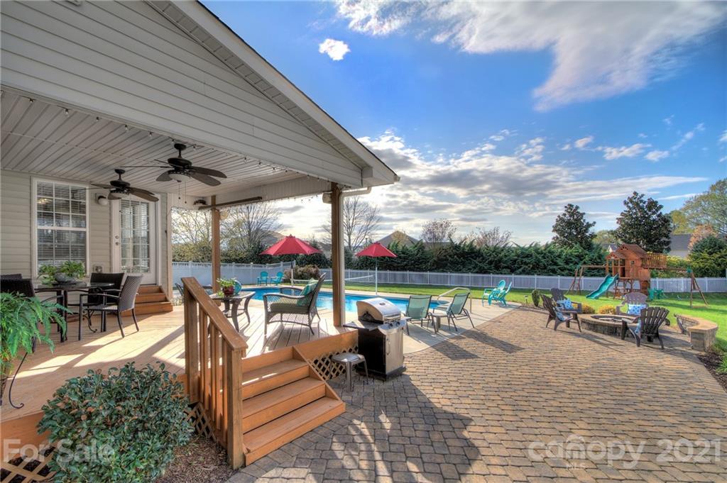 7025 Meyer Road Fort Mill, SC 29715 - Photo 30 of 41 a view of a patio with chairs and table of chairs