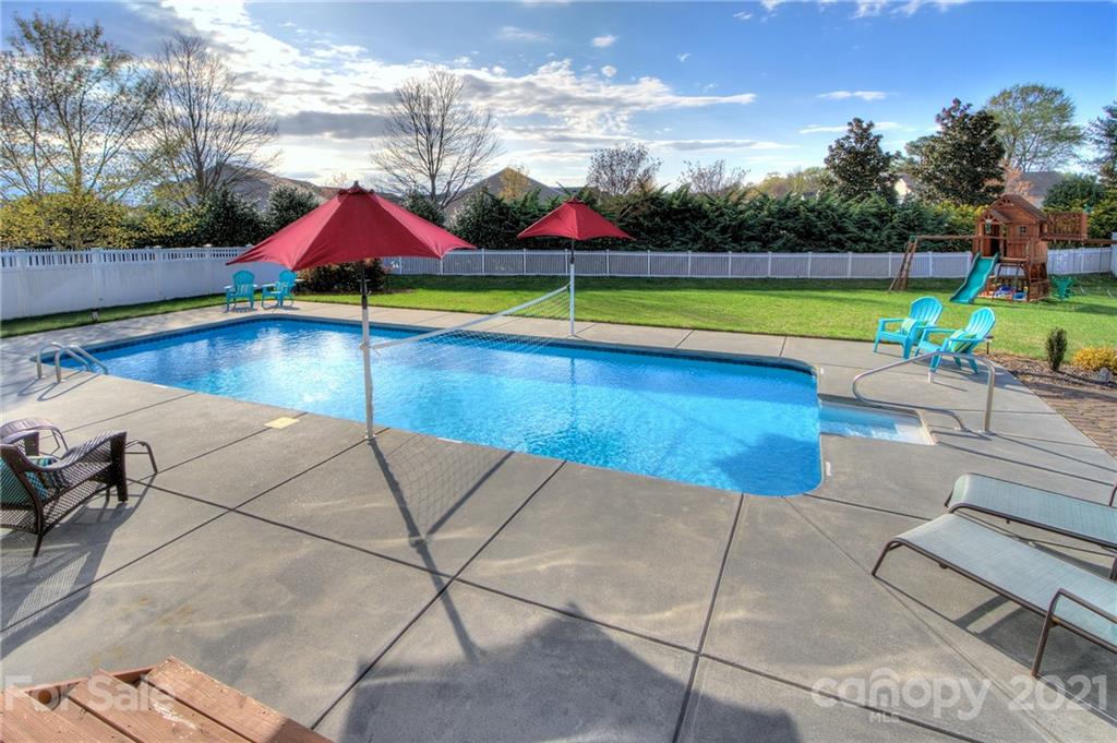 7025 Meyer Road Fort Mill, SC 29715 - Photo 31 of 41 a view of a swimming pool with lounge chairs