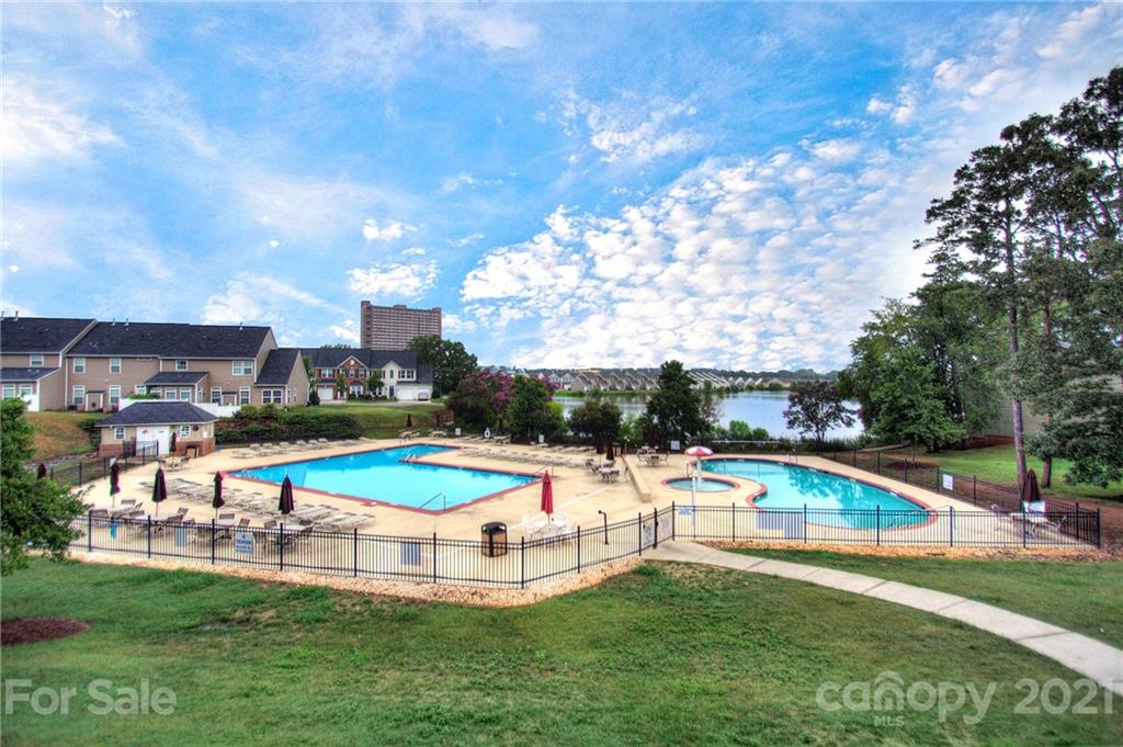 7025 Meyer Road Fort Mill, SC 29715 - Photo 39 of 41 a view of a swimming pool with lawn chairs and a big yard