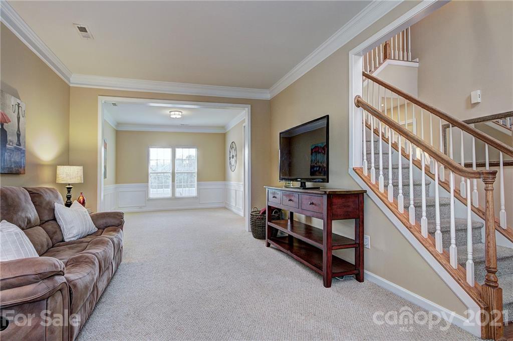 7025 Meyer Road Fort Mill, SC 29715 - Photo 7 of 41 a living room with furniture and a flat screen tv