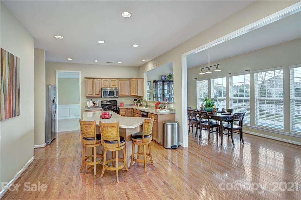 7025 Meyer Road Fort Mill, SC 29715 - Photo 10 of 41 a dining room with furniture window and wooden floor