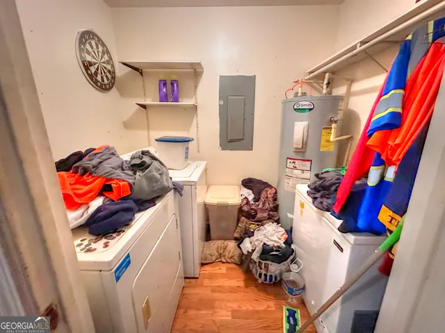 a living room with furniture and a bed