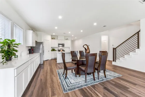 a view of a dining room with furniture