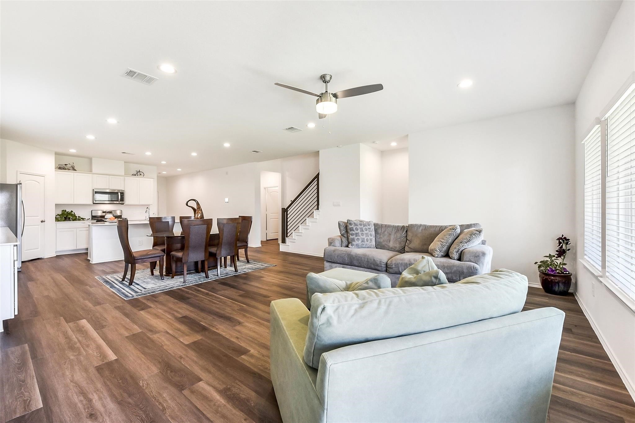 4985 Blue Beetle Rdg Drive Katy, TX 77493 - Photo 14 of 40 a living room with furniture and kitchen view