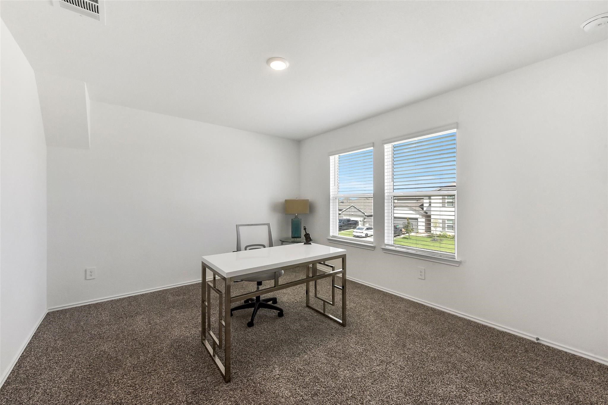 4985 Blue Beetle Rdg Drive Katy, TX 77493 - Photo 26 of 40 a view of a workspace with furniture and a window