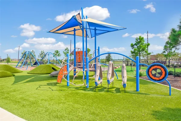 a view of swimming pool with a backyard and slide