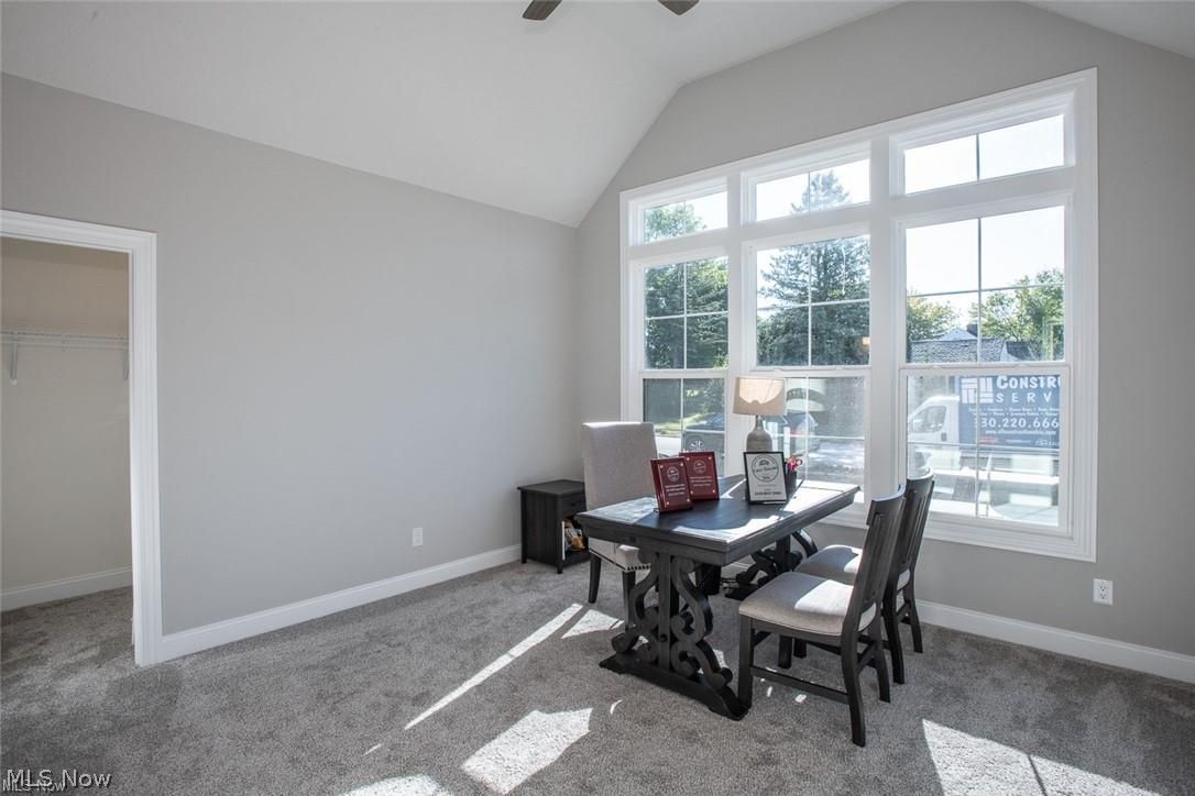 34286 Brookside Lane North Ridgeville, OH 44039 - Photo 29 of 50 Dining area featuring carpet, vaulted ceiling, and a ceiling fan
