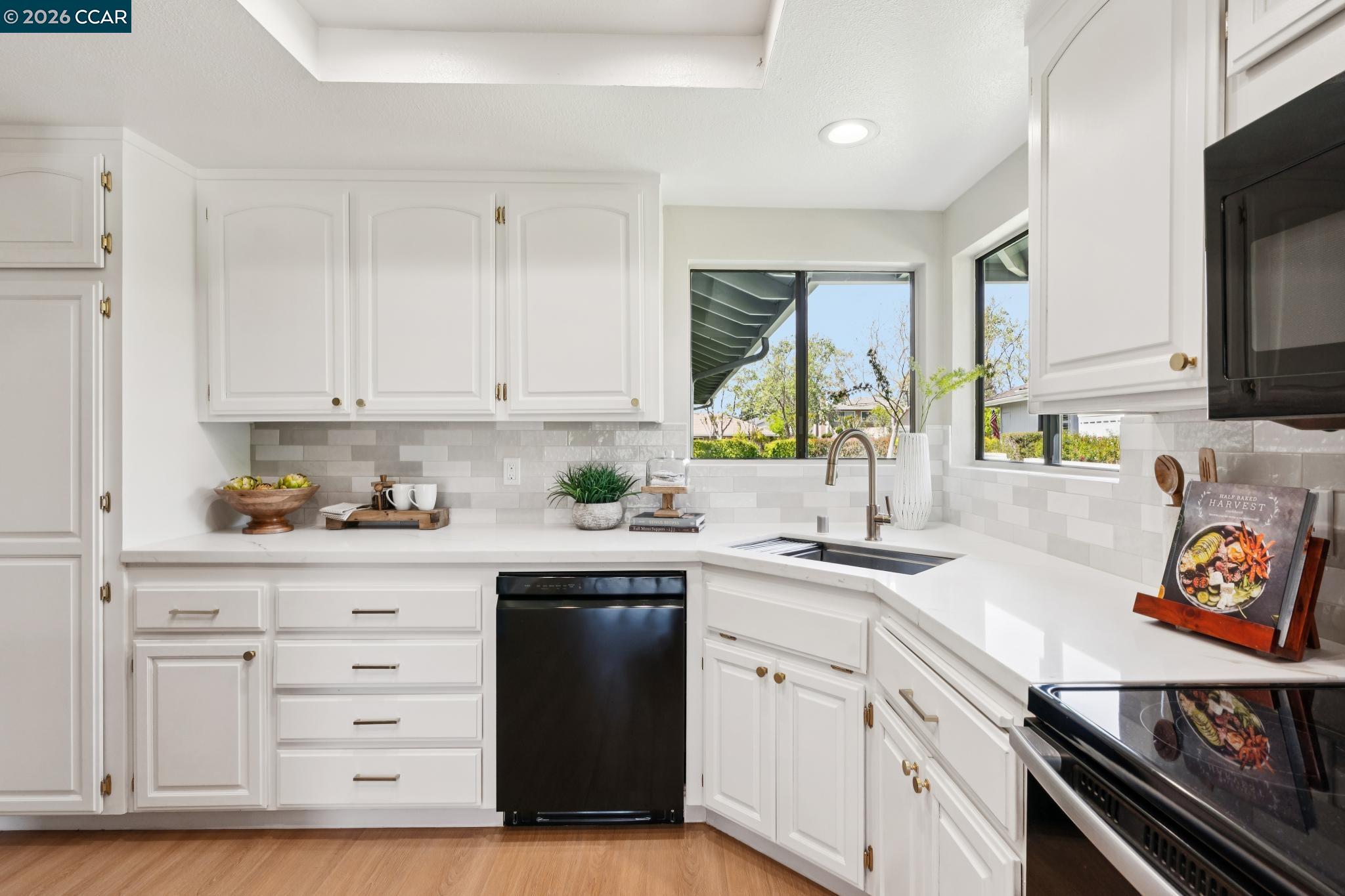 1864 St George Road Danville, CA 94526 - Photo 15 of 39 a kitchen with granite countertop a sink stainless steel appliances and cabinets