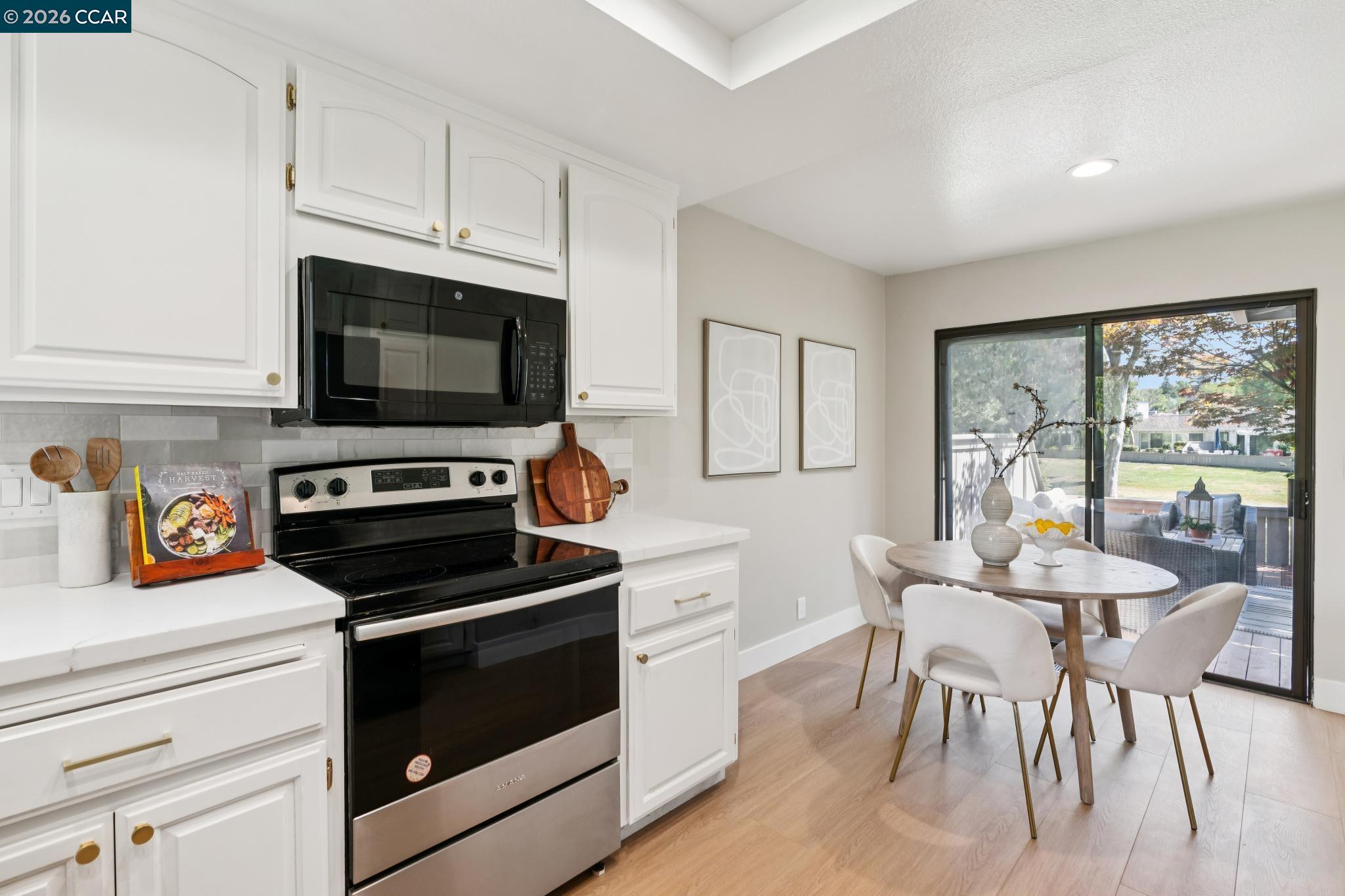 1864 St George Road Danville, CA 94526 - Photo 17 of 39 a kitchen with a stove a sink and a microwave