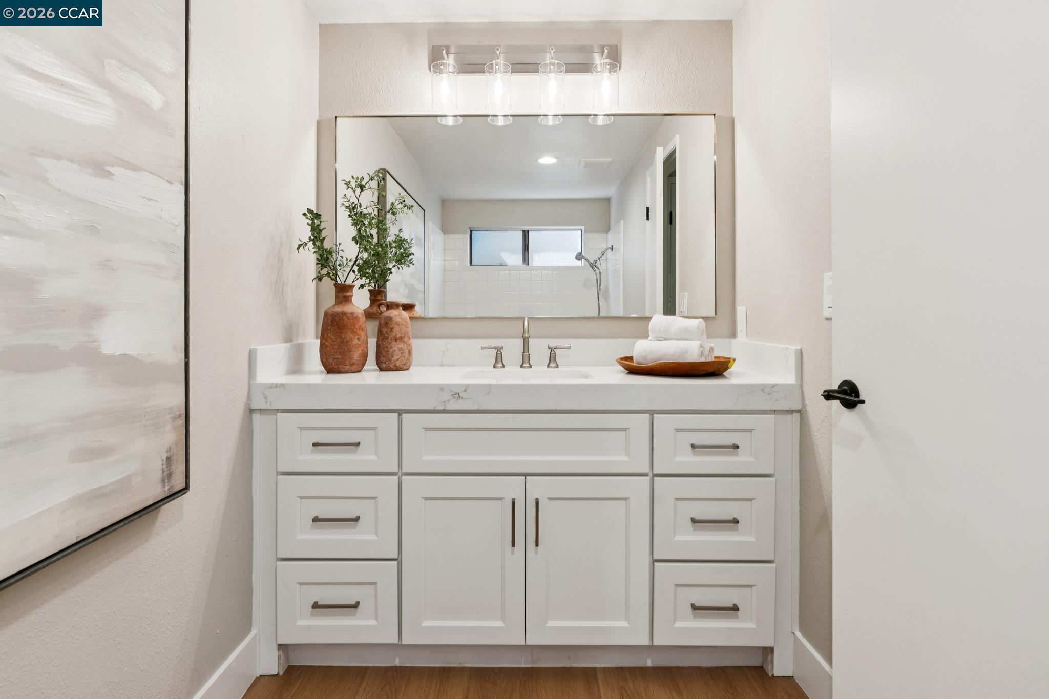 1864 St George Road Danville, CA 94526 - Photo 28 of 39 a bathroom with a sink vanity granite and a mirror