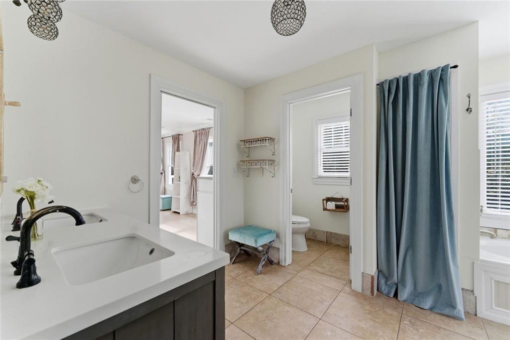 302 Hascall Road Northwest Atlanta, GA 30309 - Photo 26 of 56 a bathroom with a sink and a mirror