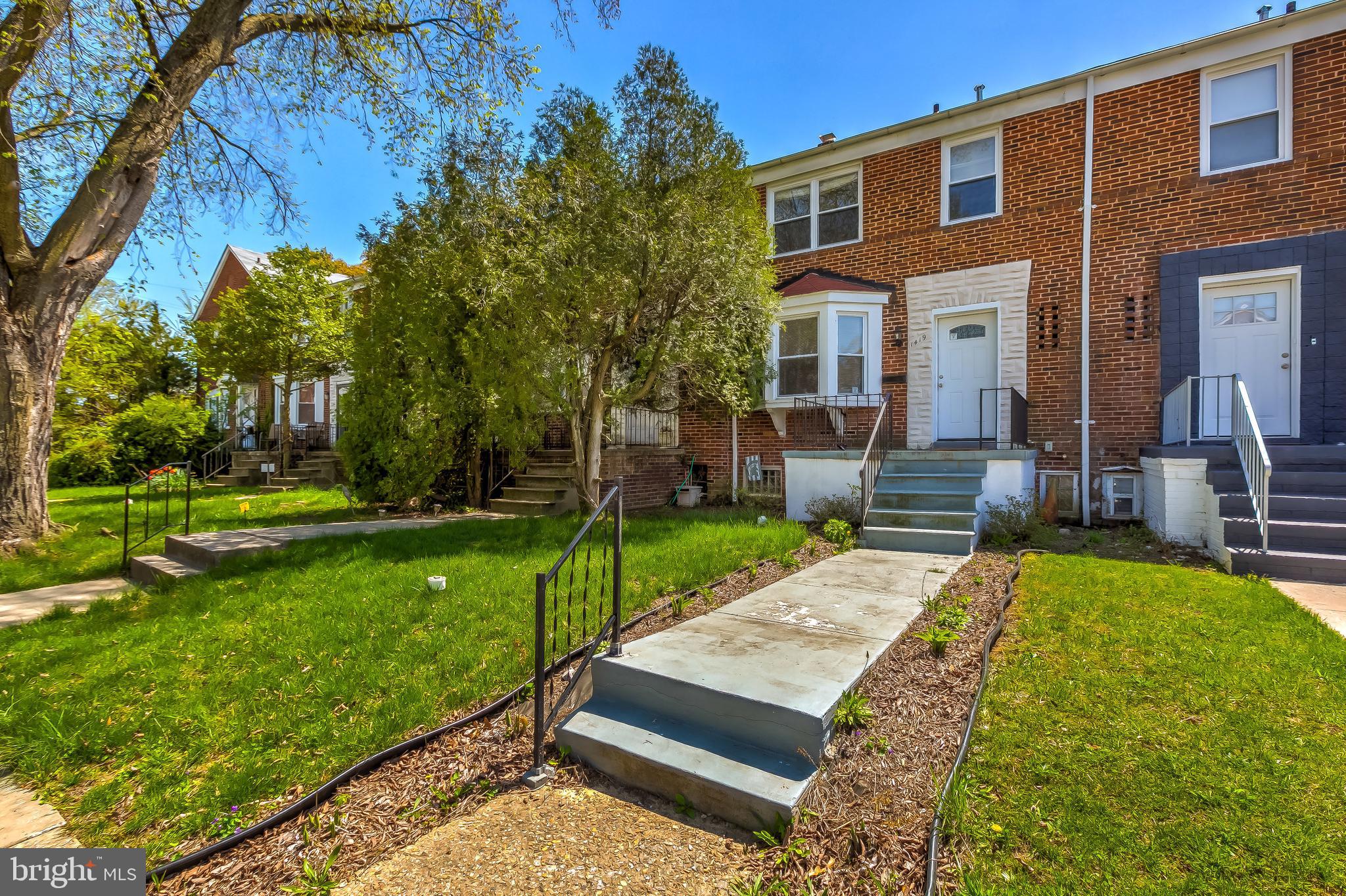 1419 Kingsway Road Baltimore, MD 21218 - Photo 1 of 38 a view of a house with backyard and sitting area