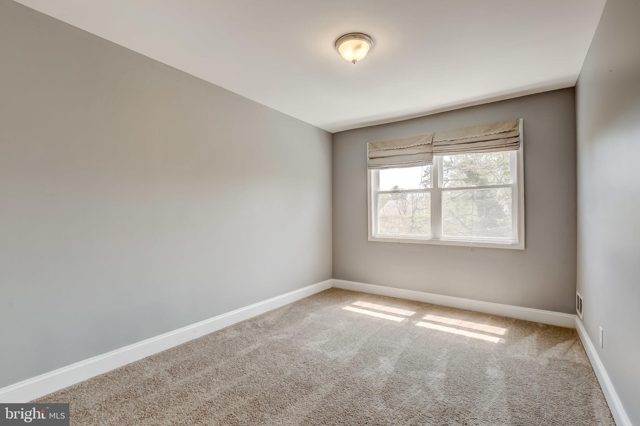 1419 Kingsway Road Baltimore, MD 21218 - Photo 18 of 38 an empty room with a window