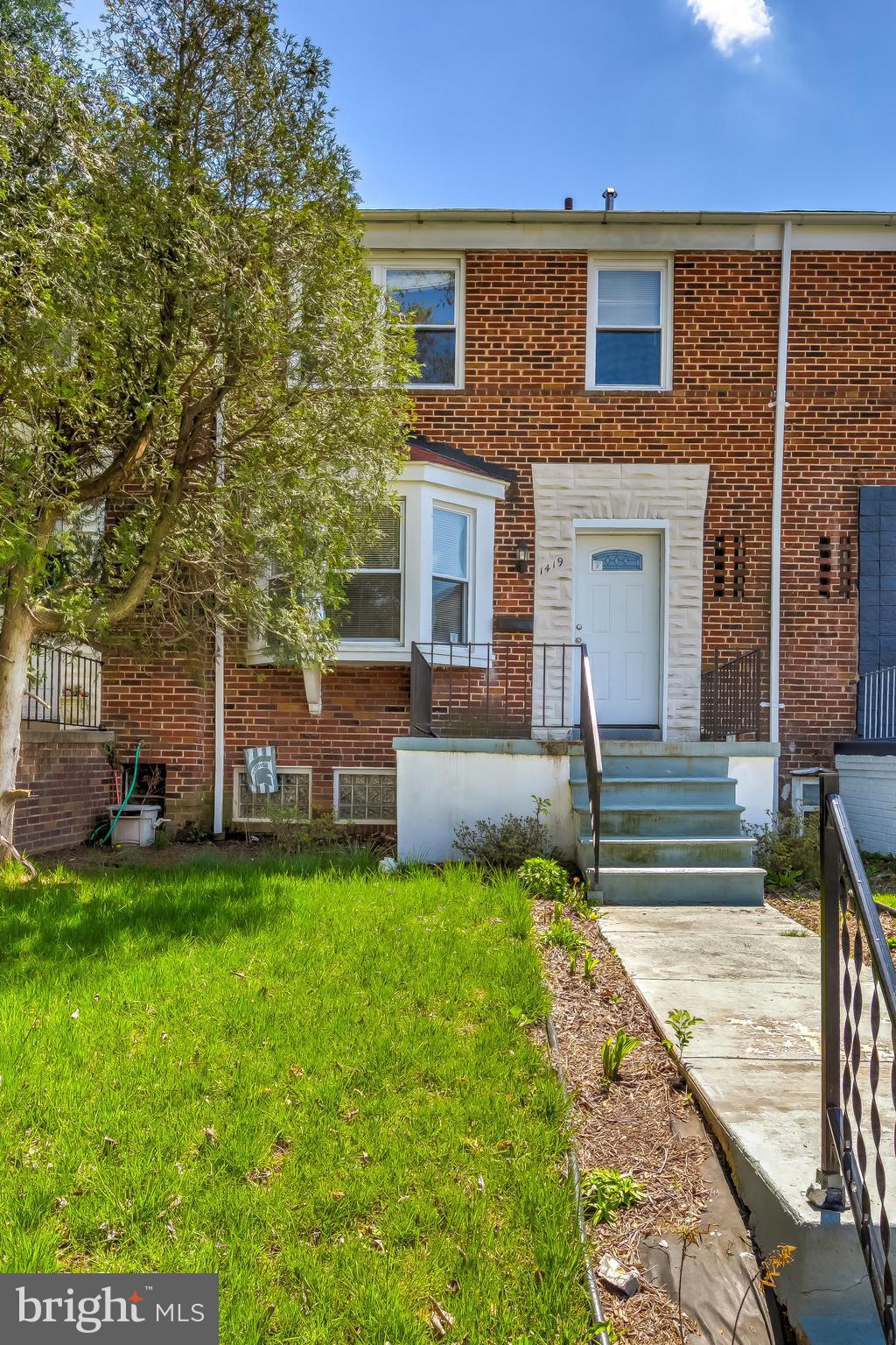 1419 Kingsway Road Baltimore, MD 21218 - Photo 3 of 38 a front view of a house with a yard