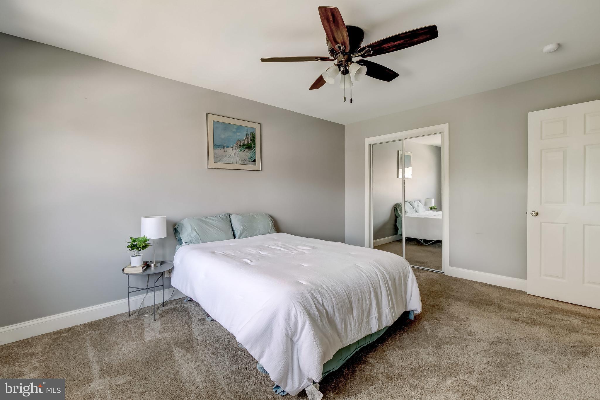 1419 Kingsway Road Baltimore, MD 21218 - Photo 26 of 38 a bedroom with a bed and a chandelier