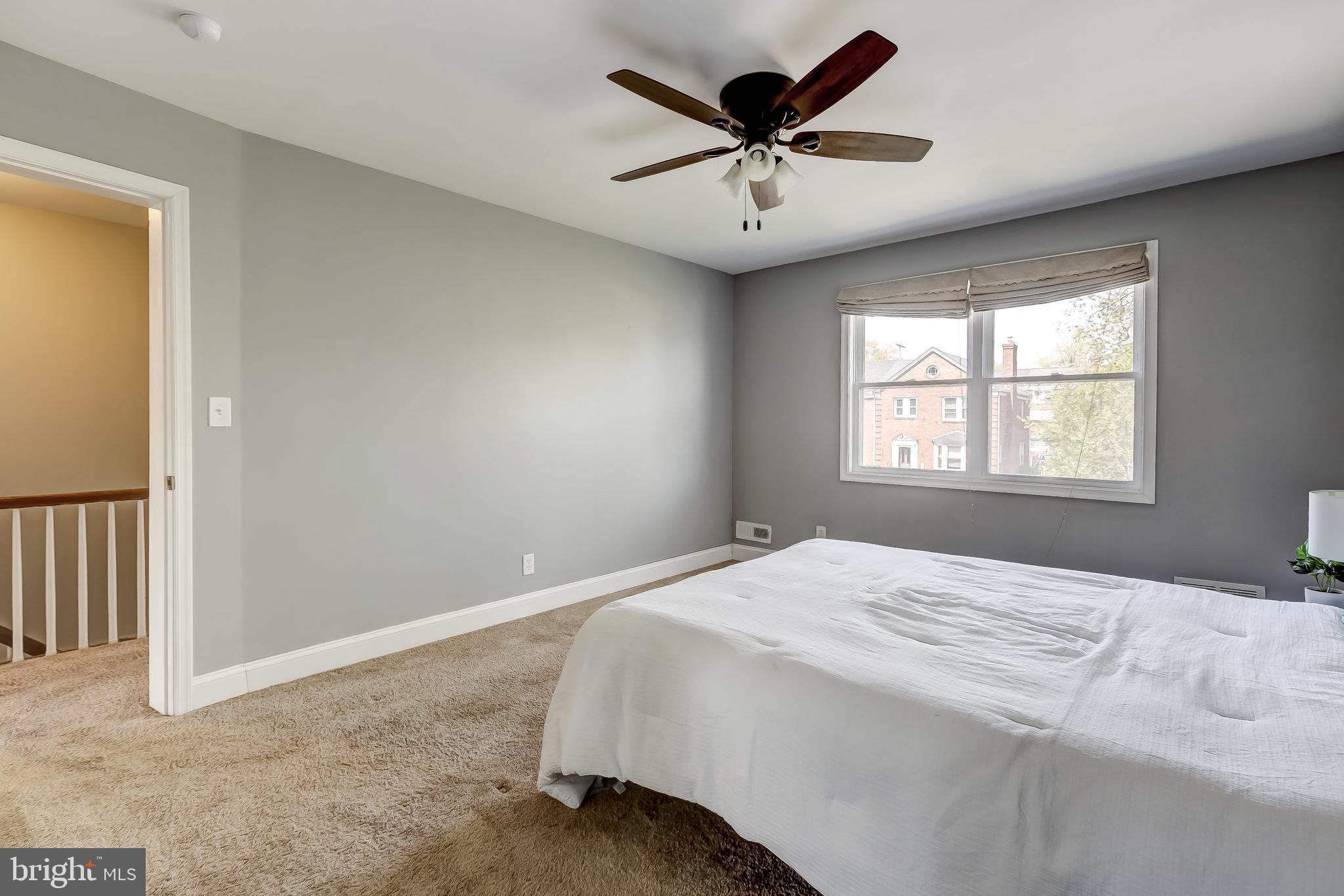 1419 Kingsway Road Baltimore, MD 21218 - Photo 27 of 38 a bedroom with a large bed and a window
