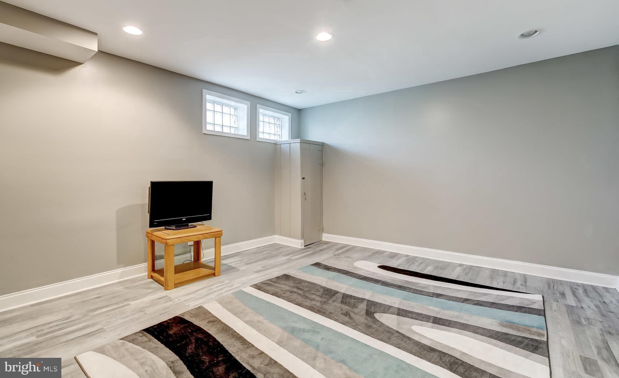 1419 Kingsway Road Baltimore, MD 21218 - Photo 29 of 38 a bedroom with a bed and a flat screen tv