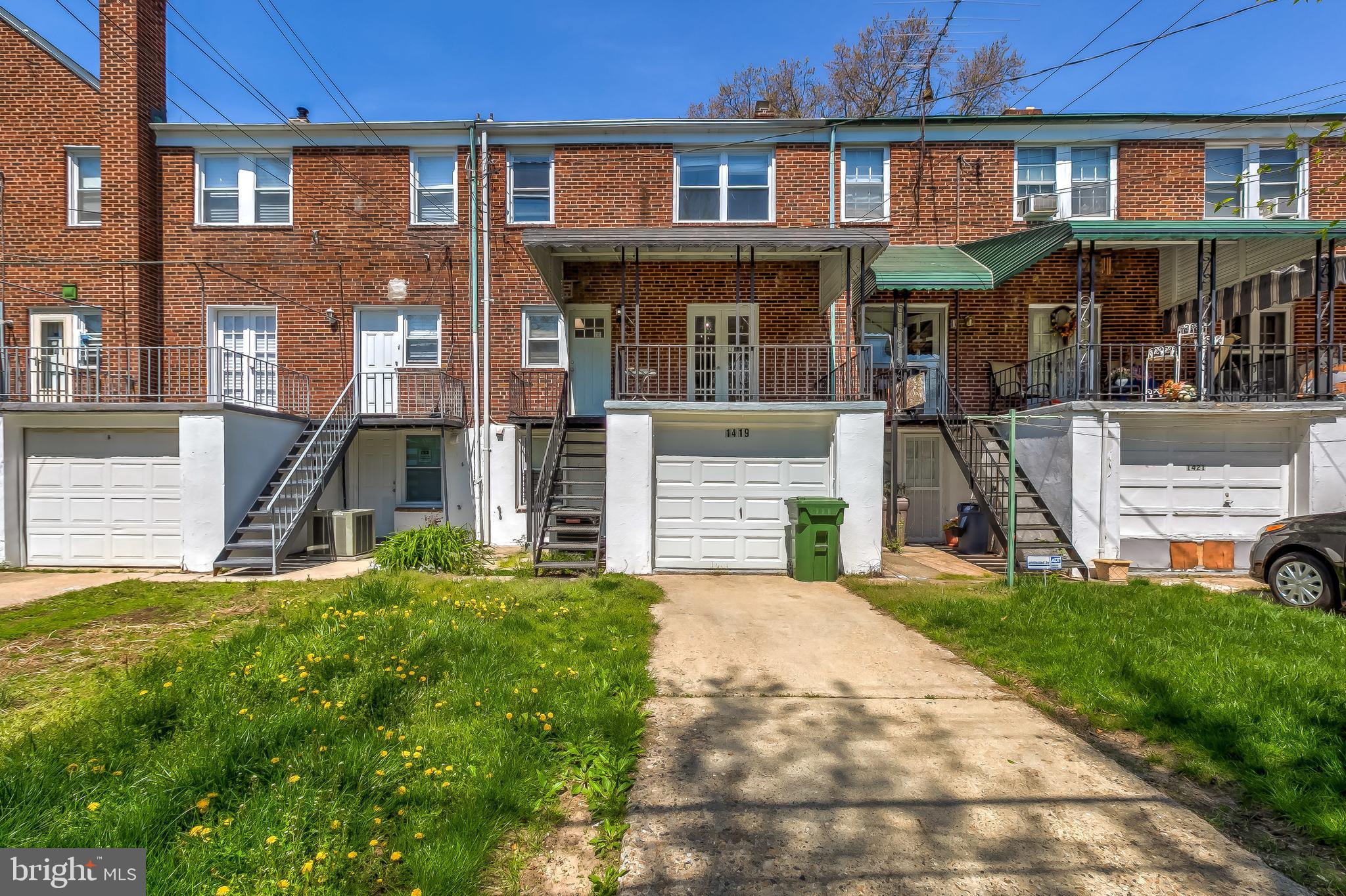 1419 Kingsway Road Baltimore, MD 21218 - Photo 36 of 38 a front view of a house with a yard
