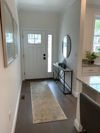 a view of a livingroom with furniture and windows