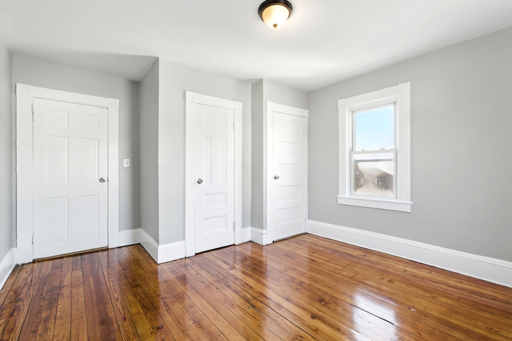 58 Governor Street Springfield, MA 01104 - Photo 17 of 23 a view of empty room with wooden floor