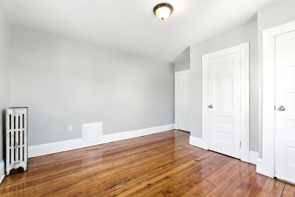58 Governor Street Springfield, MA 01104 - Photo 18 of 23 a view of empty room with wooden floor