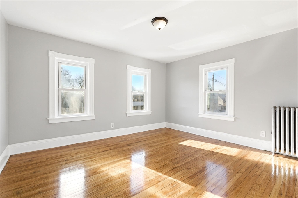58 Governor Street Springfield, MA 01104 - Photo 22 of 23 a view of empty room with wooden floor and fan