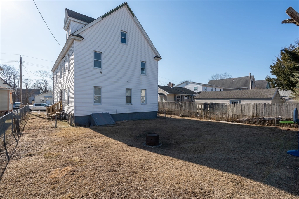 58 Governor Street Springfield, MA 01104 - Photo 23 of 23 a view of a white house with a yard