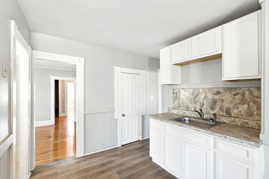 58 Governor Street Springfield, MA 01104 - Photo 3 of 23 a bathroom with a sink and a mirror