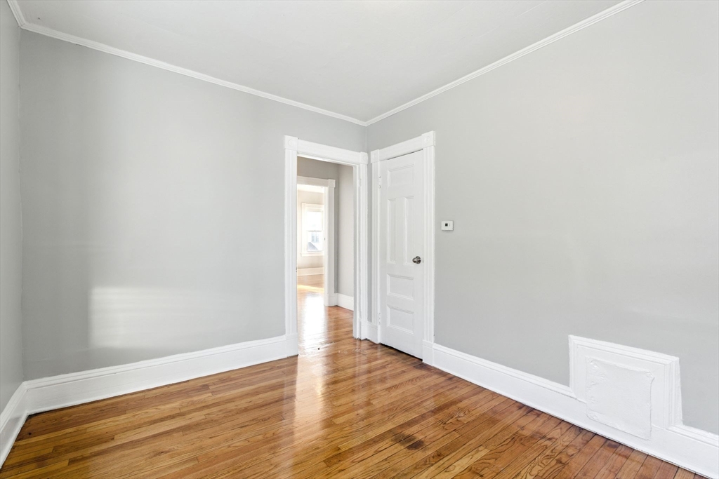 58 Governor Street Springfield, MA 01104 - Photo 9 of 23 a view of an empty room with wooden floor