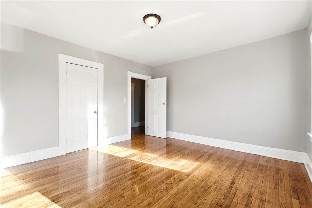 58 Governor Street Springfield, MA 01104 - Photo 10 of 23 a view of an empty room with wooden floor