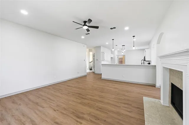 a view of a kitchen with furniture and a fireplace