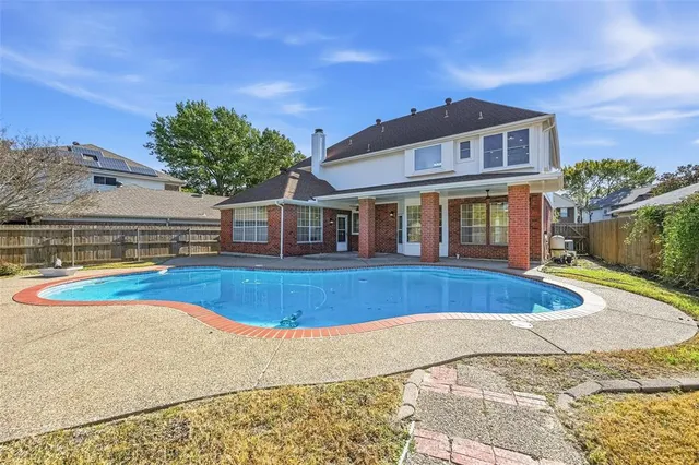 a front view of a house with swimming pool