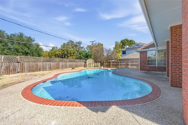 a view of outdoor space and swimming pool