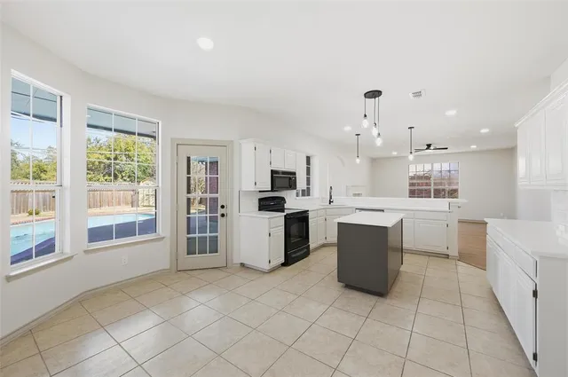 a kitchen with a sink and counter top space