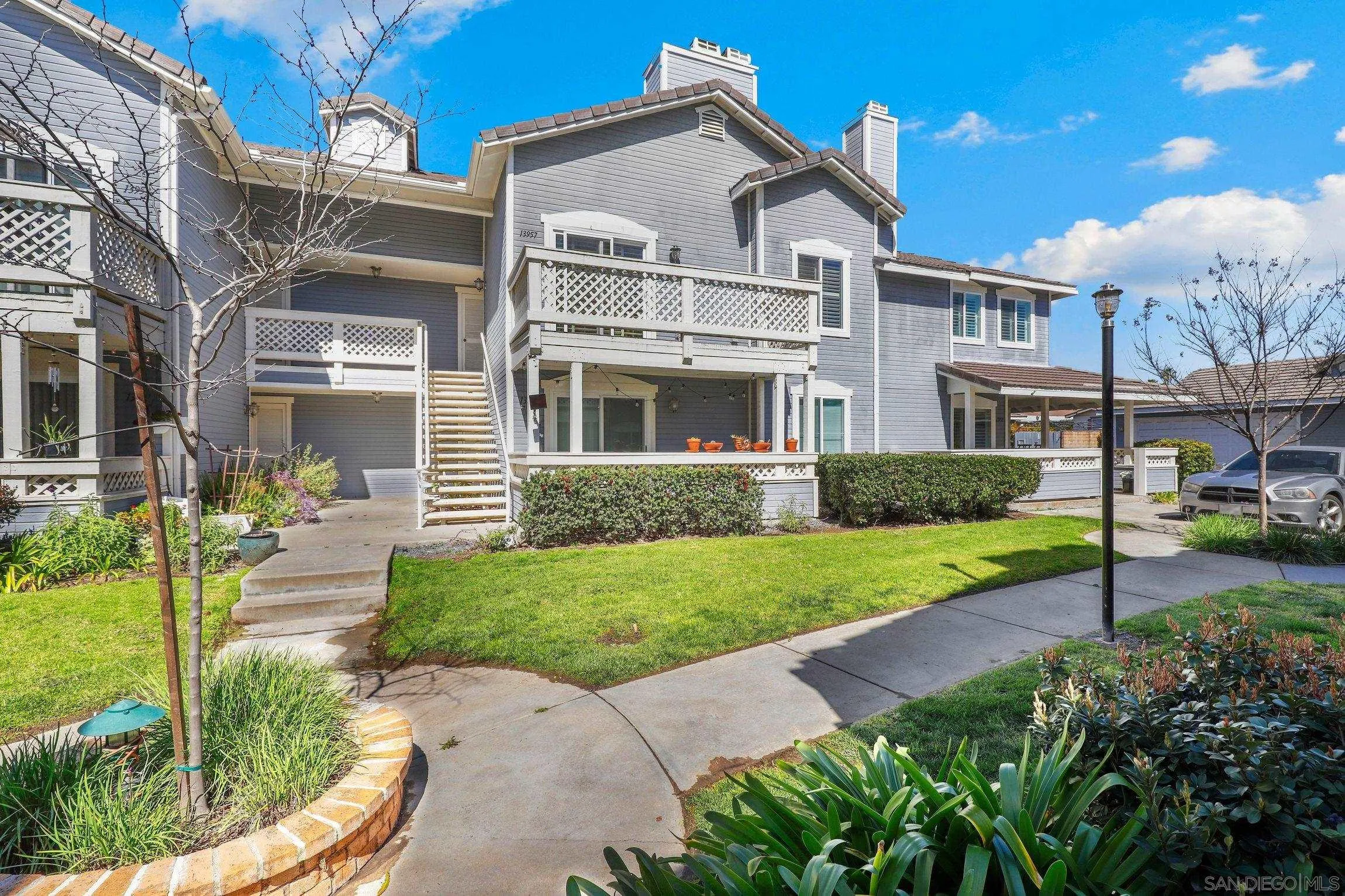 13957 Midland Road Poway, CA 92064 - Photo 1 of 26 a front view of a house with a yard and porch