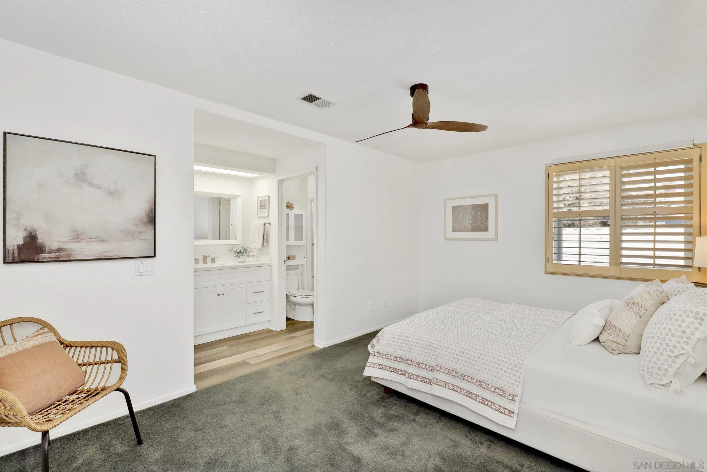 13957 Midland Road Poway, CA 92064 - Photo 11 of 26 a bedroom with a bed and a chair
