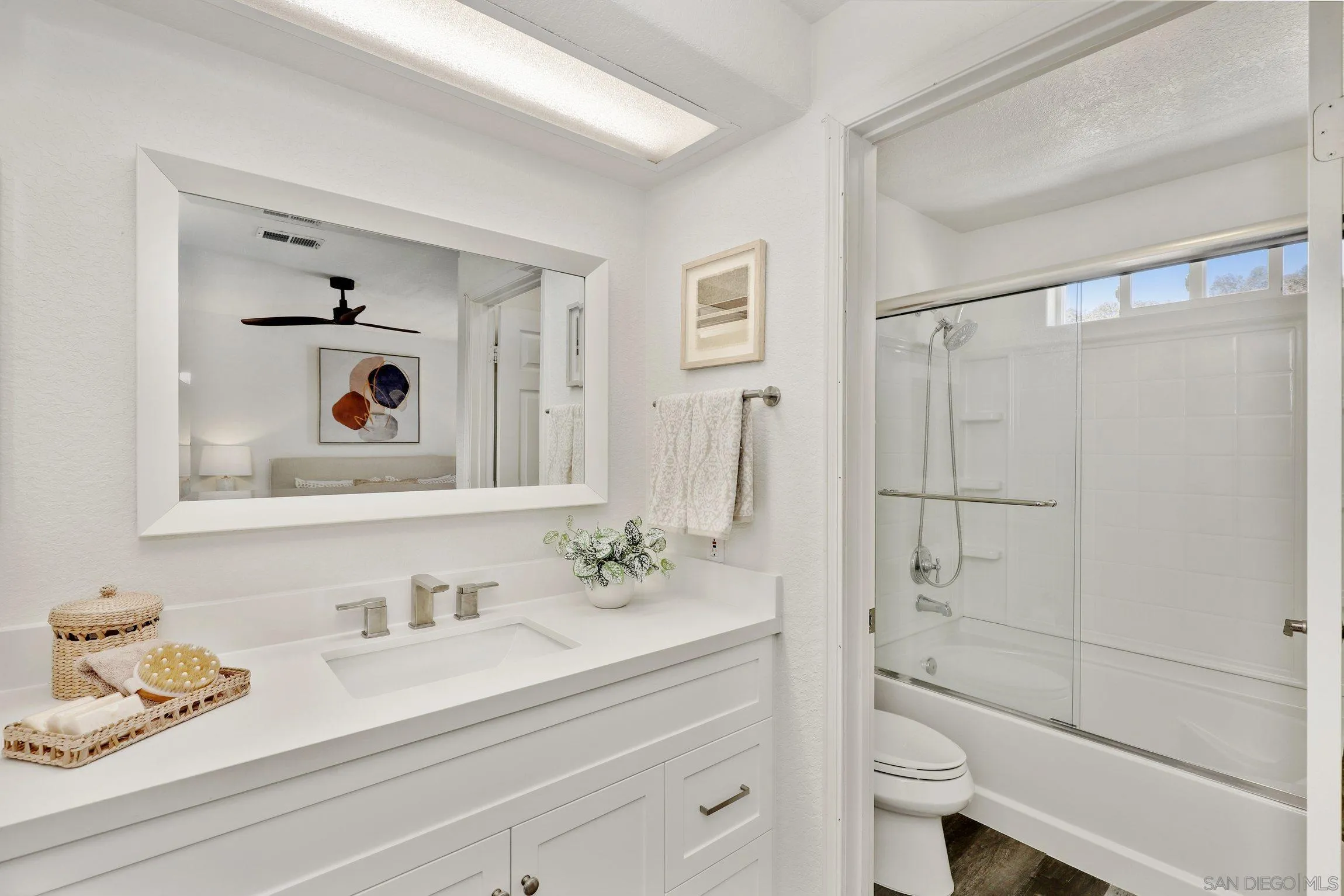 13957 Midland Road Poway, CA 92064 - Photo 14 of 26 a bathroom with a granite countertop sink mirror and shower
