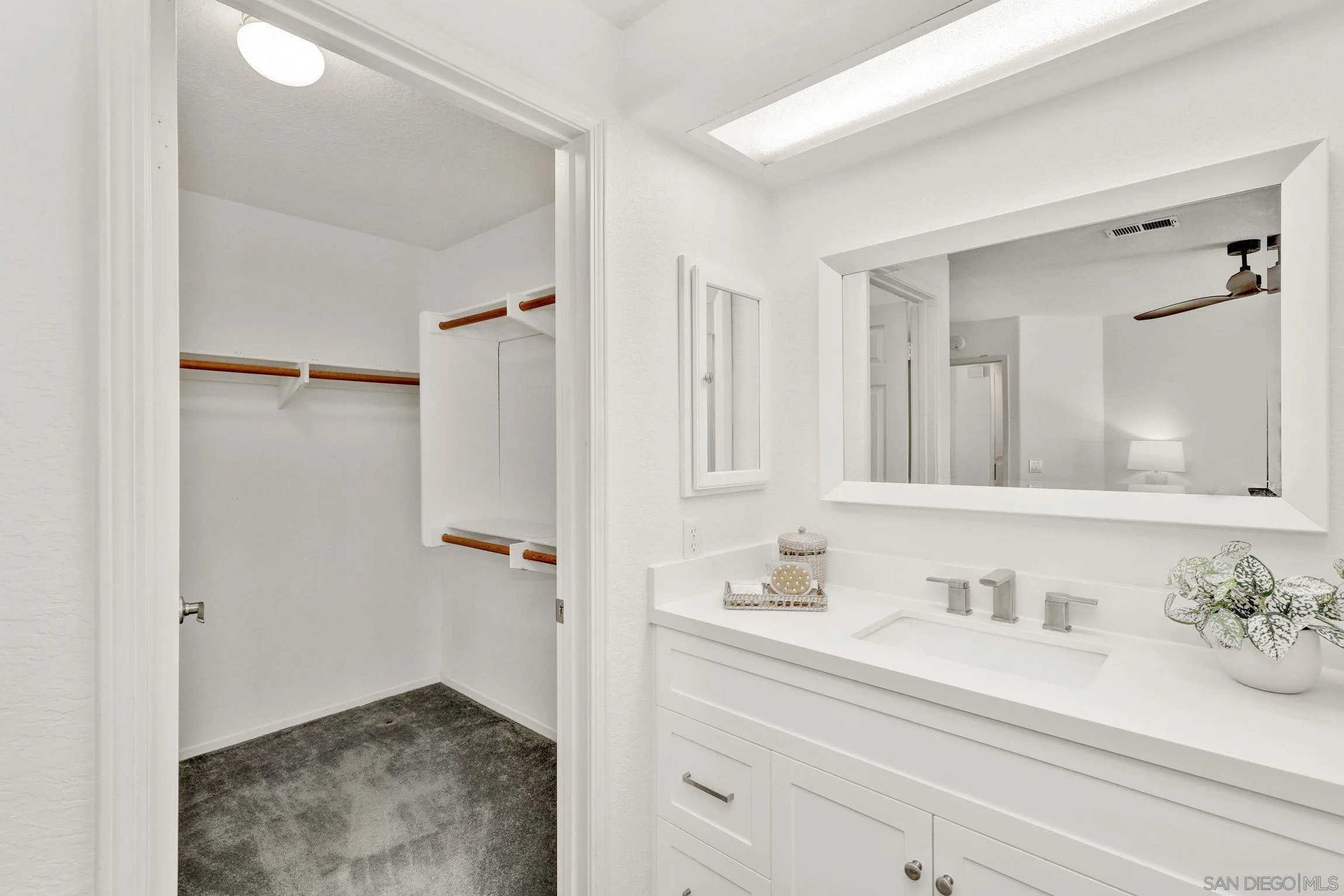 13957 Midland Road Poway, CA 92064 - Photo 15 of 26 a bathroom with a granite countertop sink and a mirror