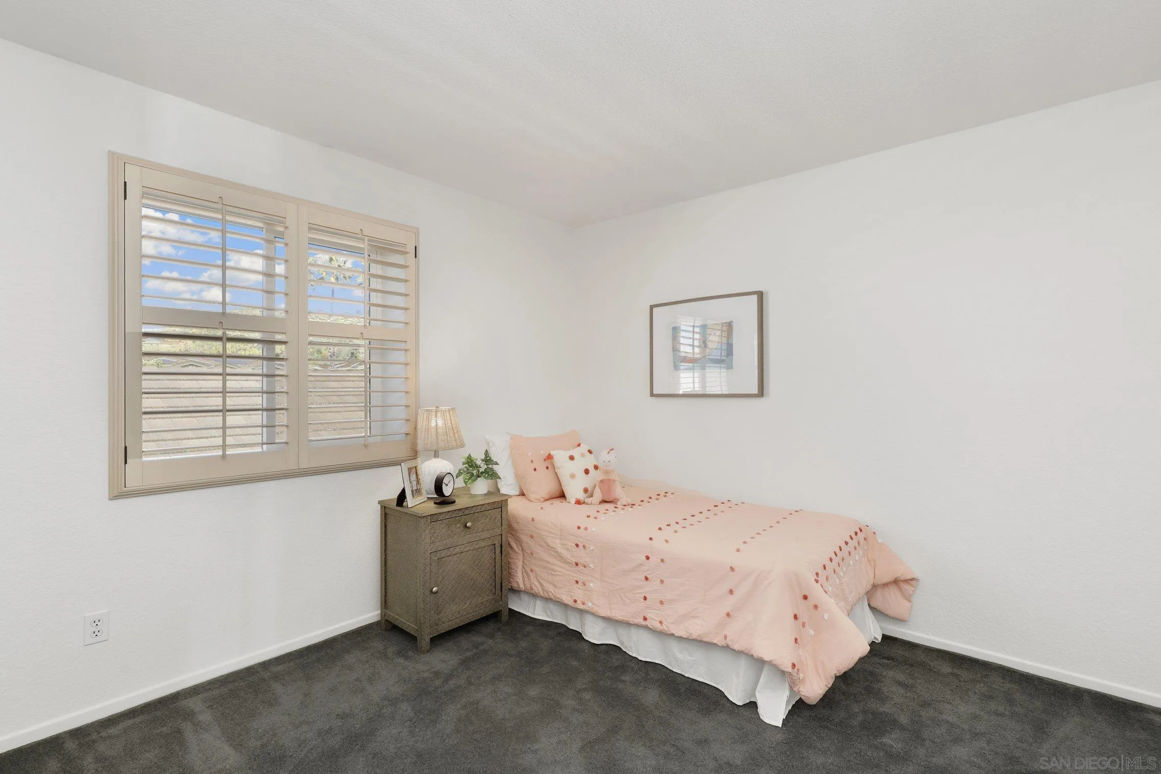 13957 Midland Road Poway, CA 92064 - Photo 17 of 26 a bedroom with a bed and a window