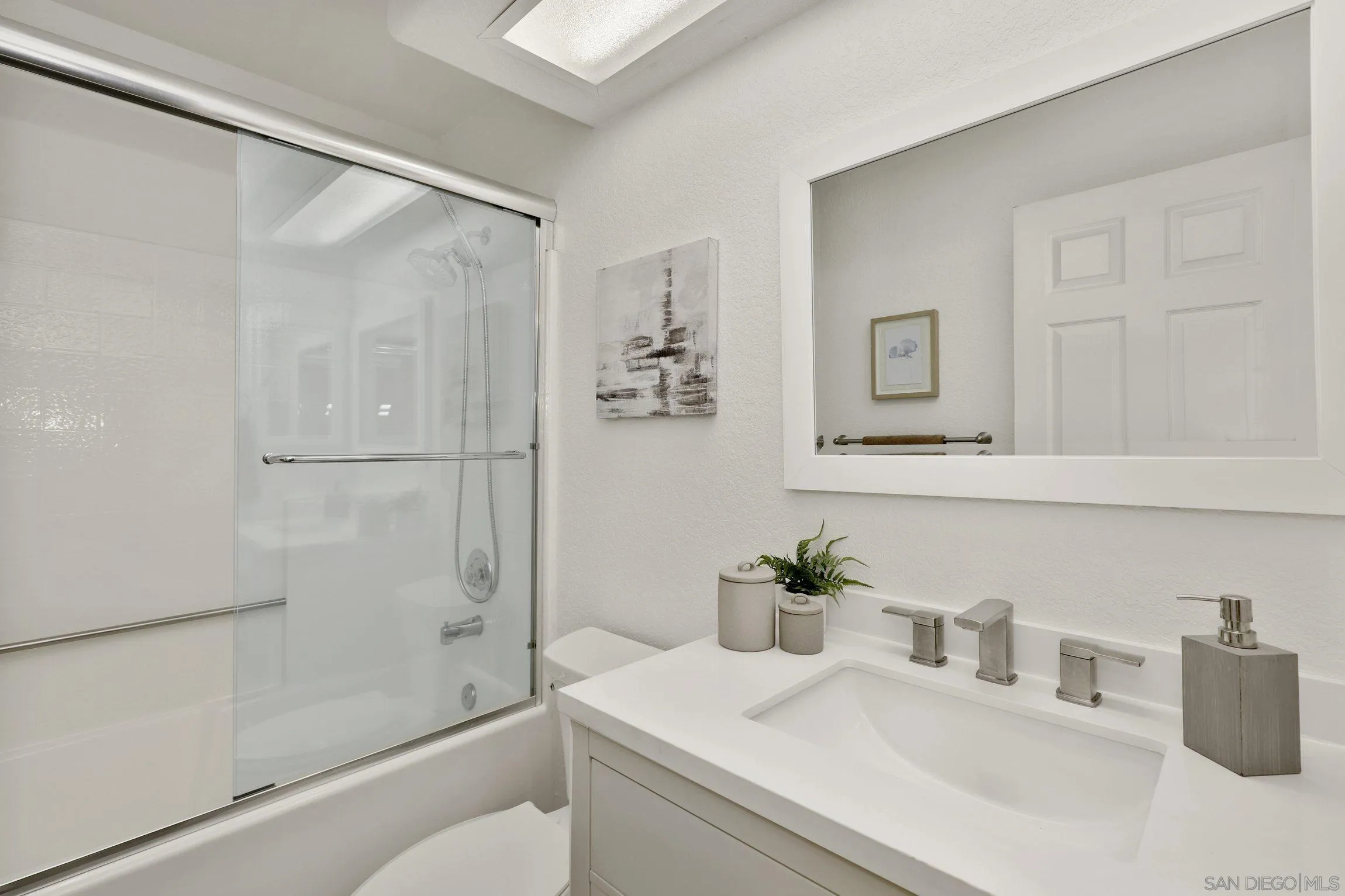 13957 Midland Road Poway, CA 92064 - Photo 19 of 26 a bathroom with a sink a toilet and shower