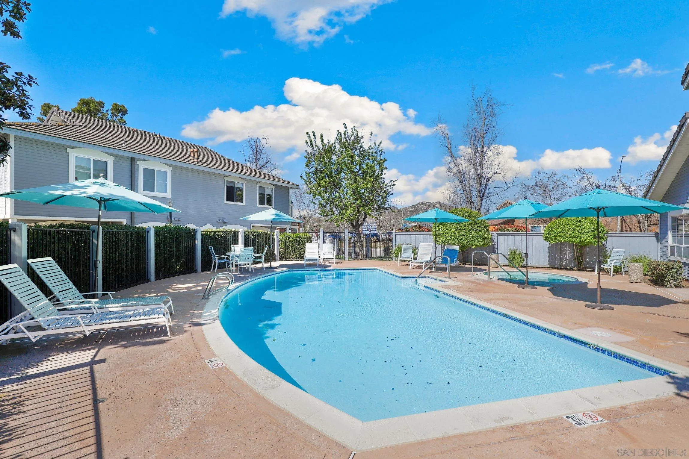 13957 Midland Road Poway, CA 92064 - Photo 22 of 26 a view of a house with swimming pool