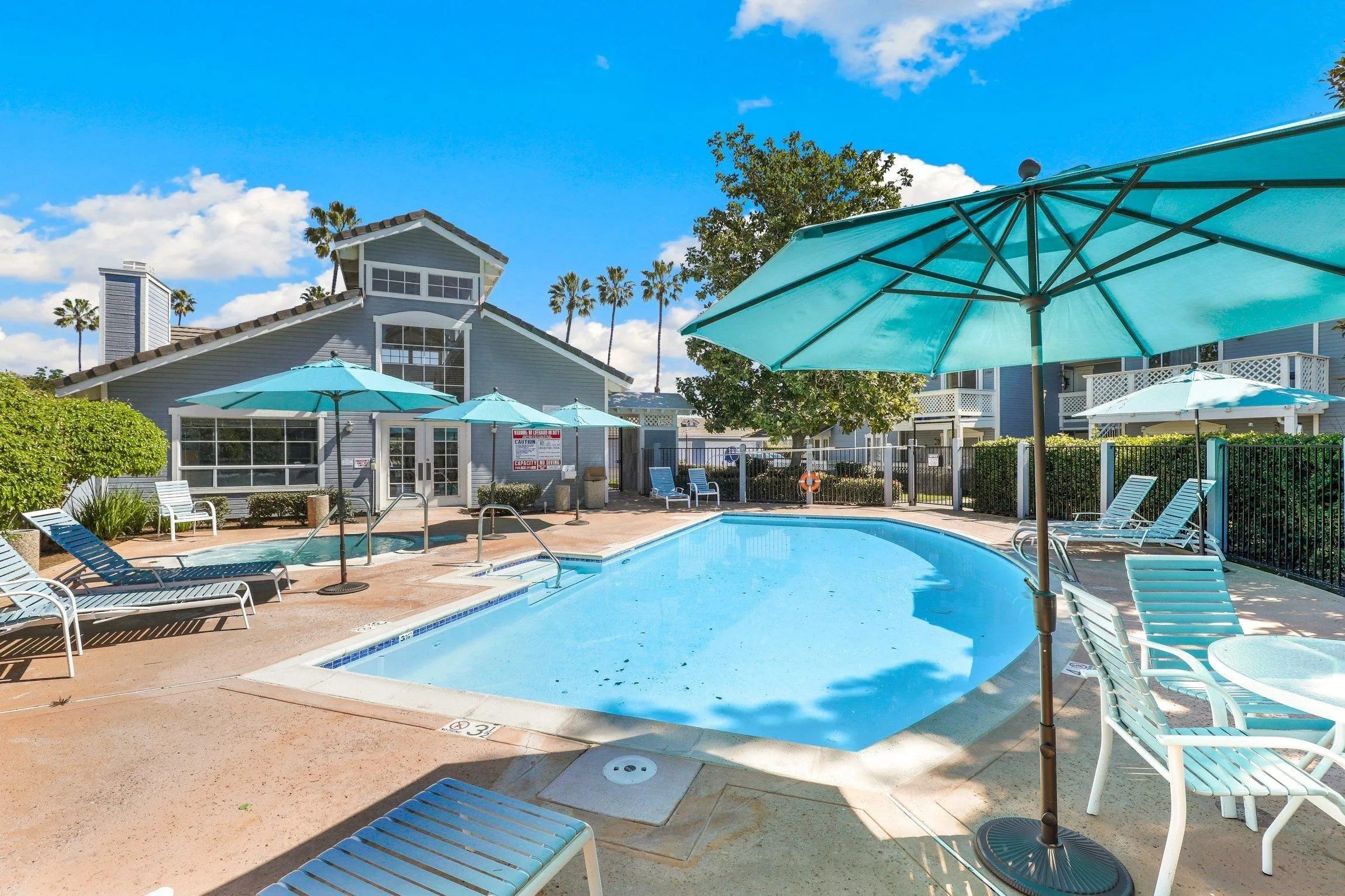 13957 Midland Road Poway, CA 92064 - Photo 23 of 26 a view of a swimming pool with chairs in patio
