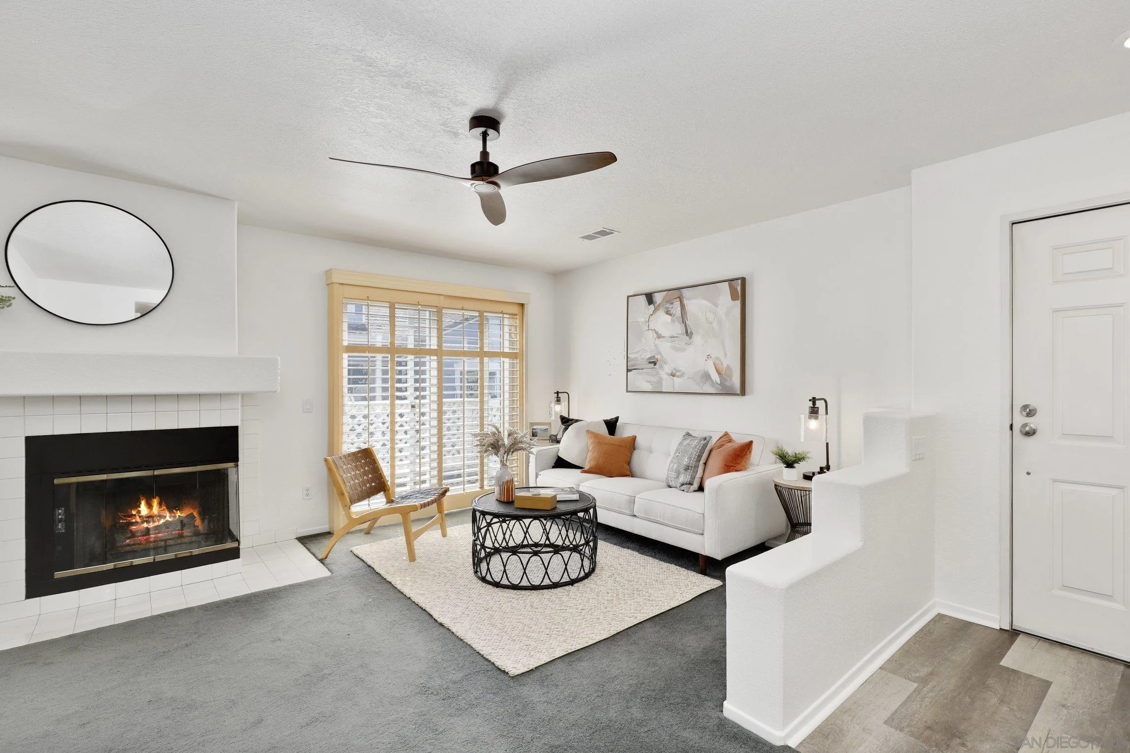 13957 Midland Road Poway, CA 92064 - Photo 3 of 26 a living room with furniture a fireplace and a large window