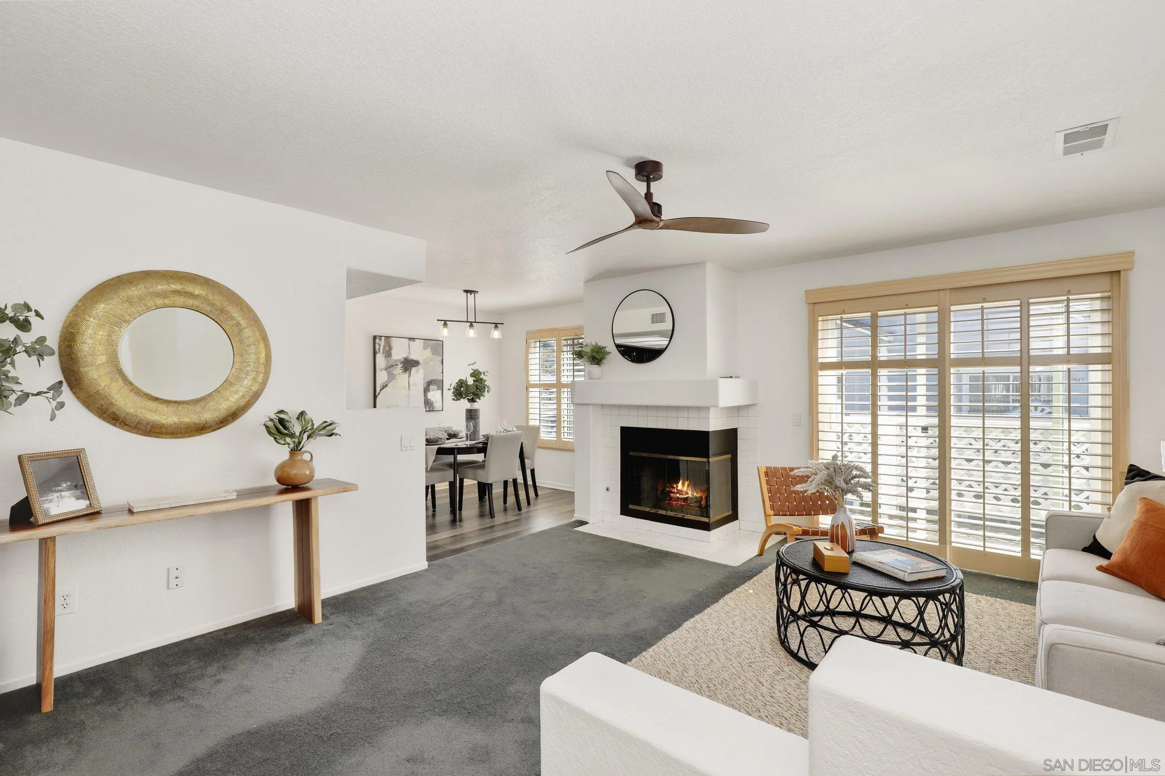 13957 Midland Road Poway, CA 92064 - Photo 5 of 26 a living room with furniture a clock and a fireplace
