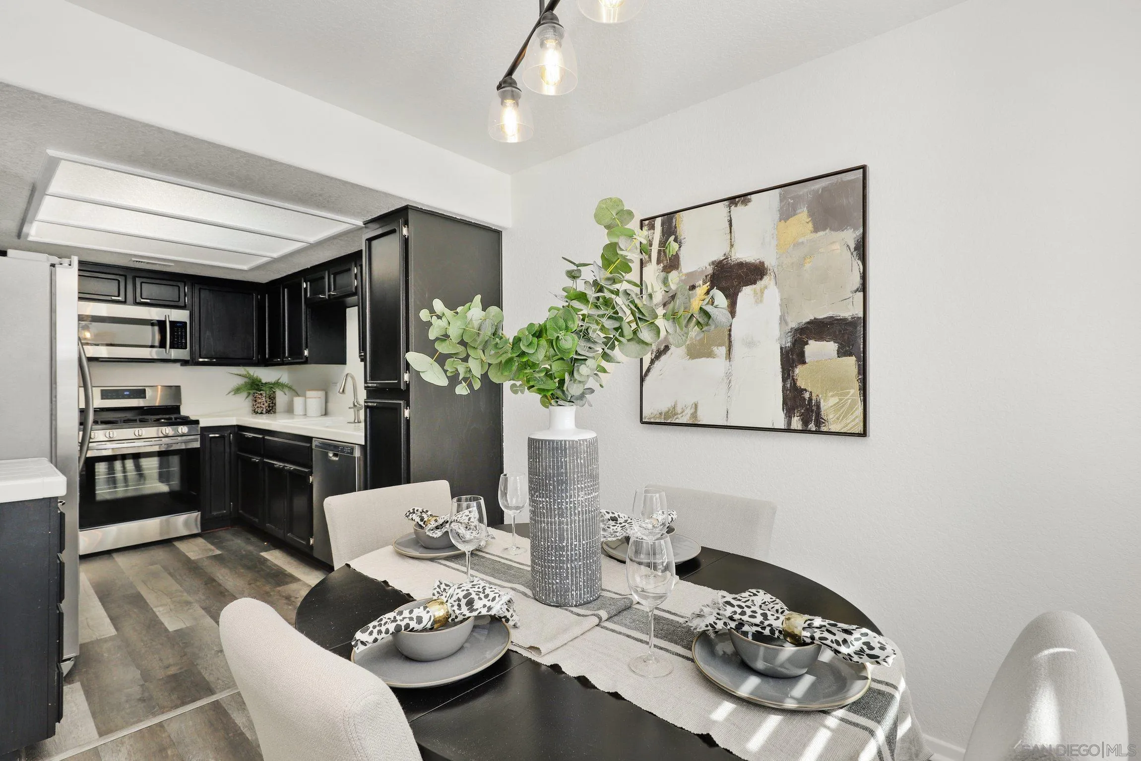 13957 Midland Road Poway, CA 92064 - Photo 7 of 26 a dining room with furniture and kitchen view