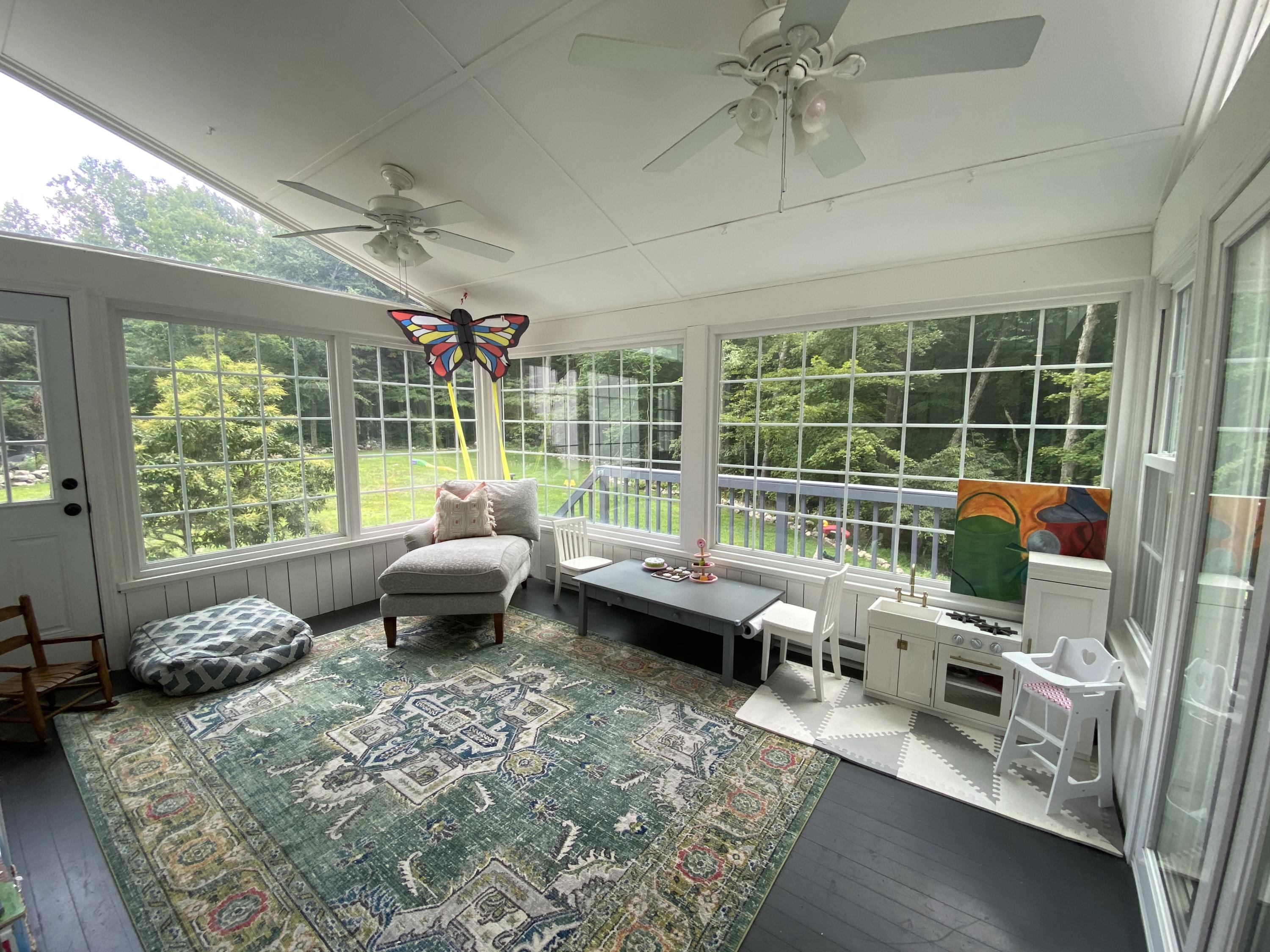 19 Clapboard Hill Road New Canaan, CT 06840 - Photo 12 of 30 a living room with furniture and a large window