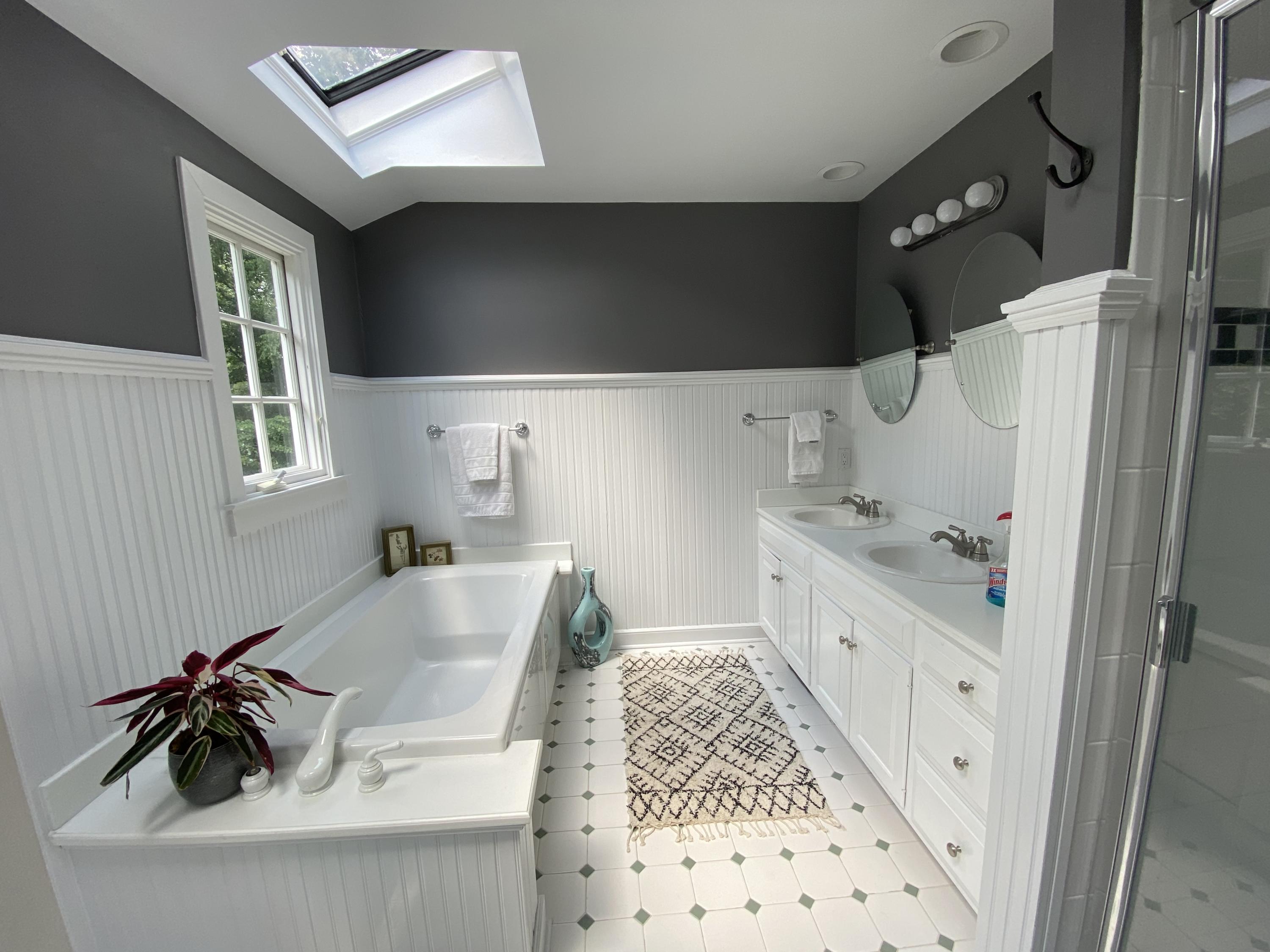 19 Clapboard Hill Road New Canaan, CT 06840 - Photo 17 of 30 a bathroom with a tub sink and mirror