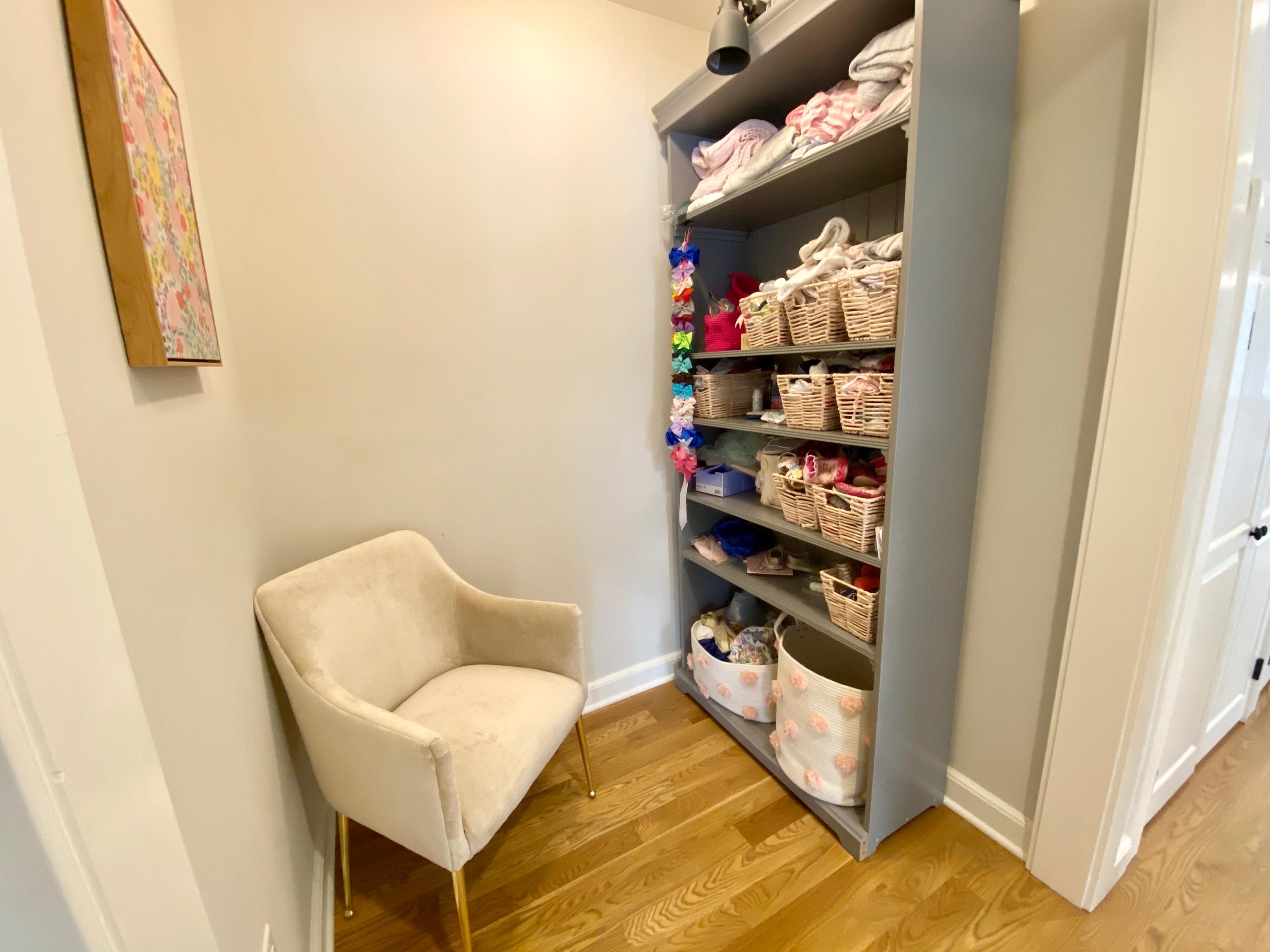 19 Clapboard Hill Road New Canaan, CT 06840 - Photo 22 of 30 a view of a hallway to room with wooden floor and cabinet