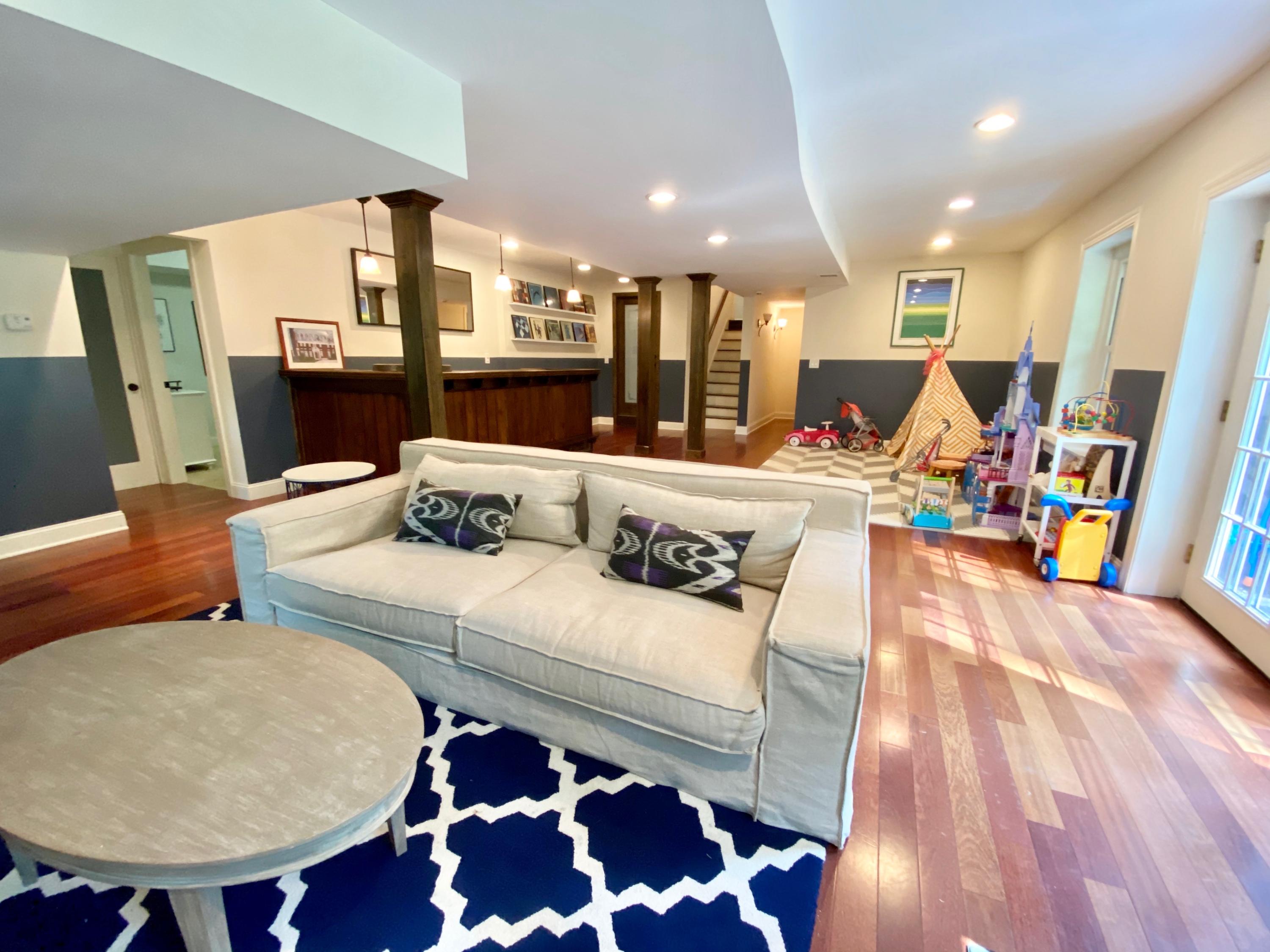19 Clapboard Hill Road New Canaan, CT 06840 - Photo 25 of 30 a living room with furniture and a wooden floor