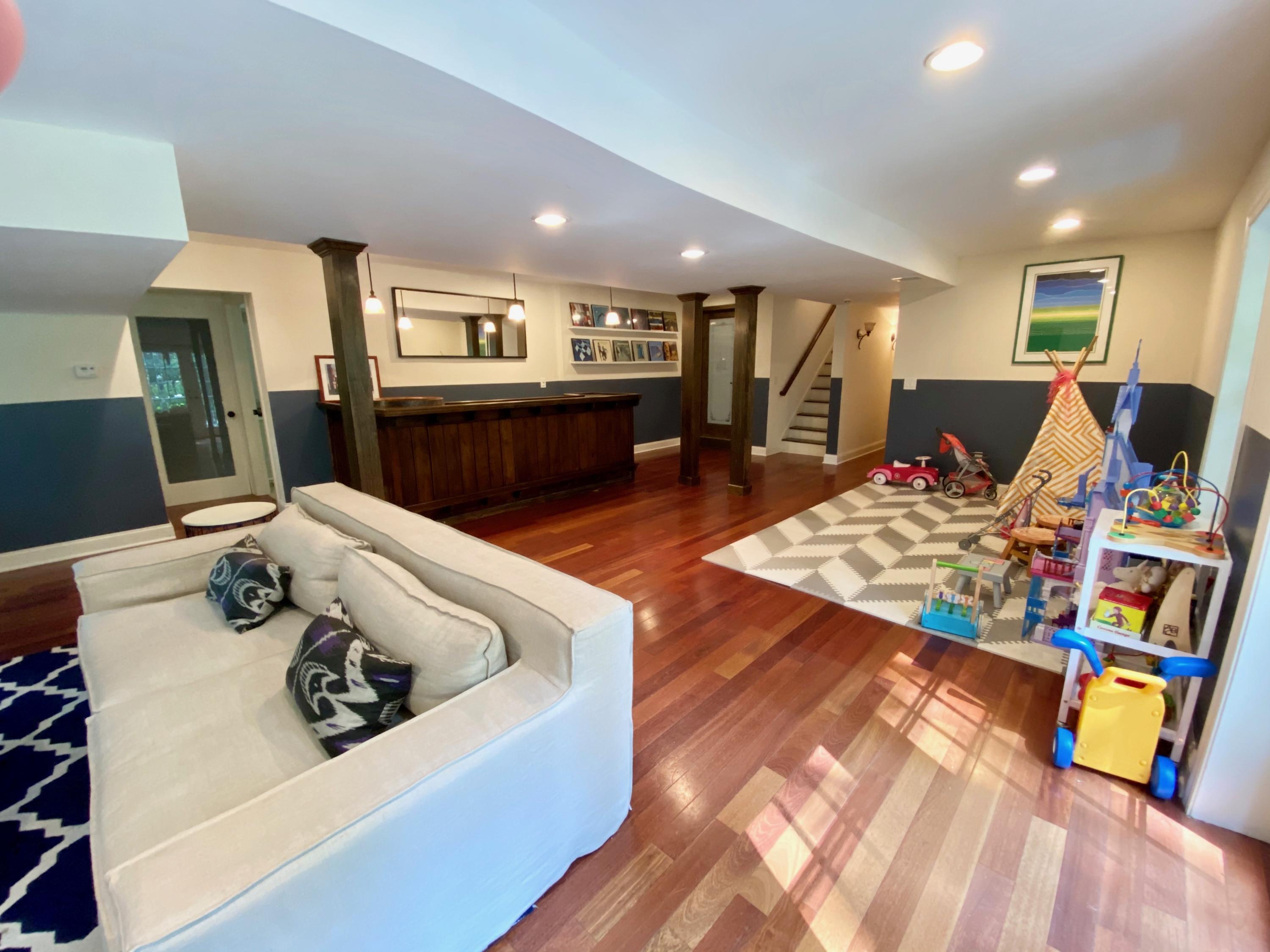 19 Clapboard Hill Road New Canaan, CT 06840 - Photo 26 of 30 a living room with furniture and a table